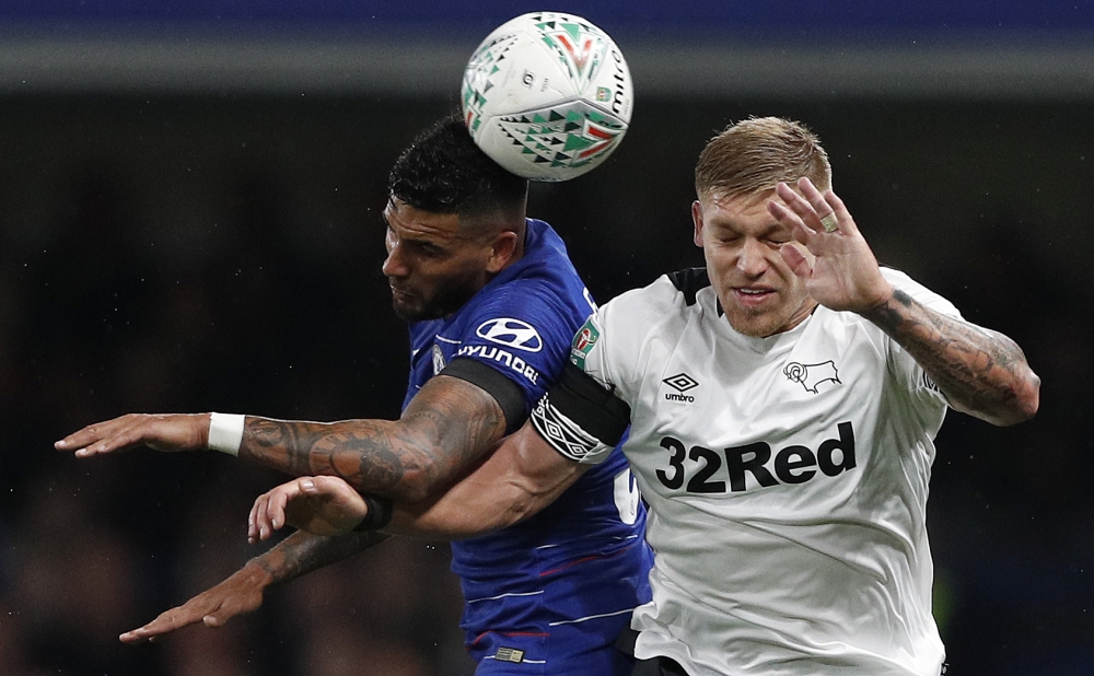 Chelsea's Brazilian defender Emerson Palmieri (L) vies to head the ball with Derby County's English midfielder Martyn Waghorn during the English League Cup football match between Chelsea and Derby County at Stamford Bridge in London on Wednesday. — AFP