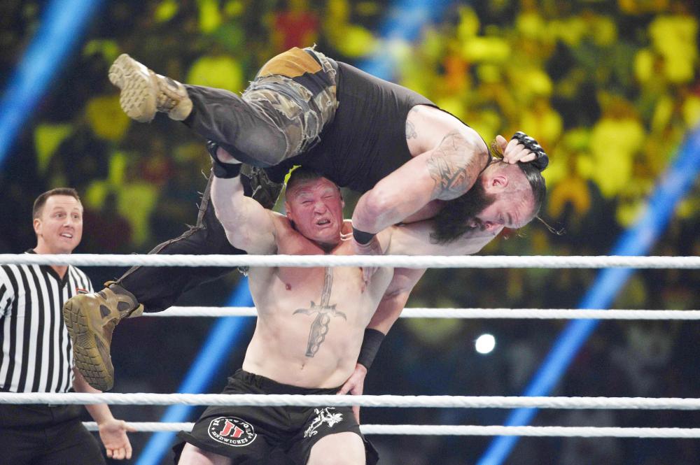 Wrestling legend Hulk Hogan greets the crowd during the WWE Crown Jewel show at the King Saud University Stadium in Riyadh Friday. — AFP