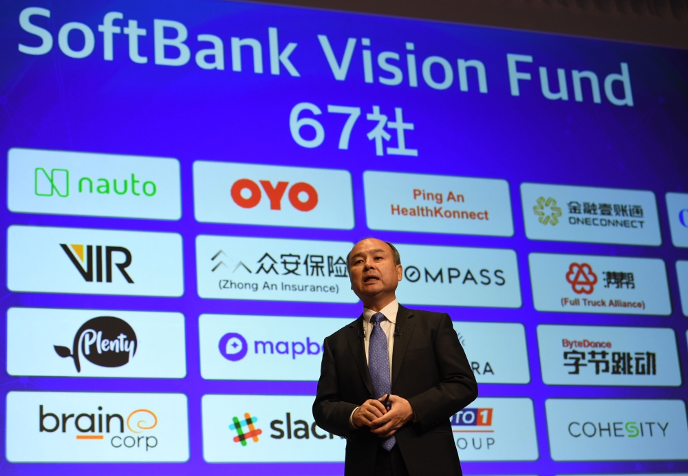 Softbank group CEO Masayoshi Son delivers a speech during his company's financial results press conference at a hotel in Tokyo on Monday. — AFP