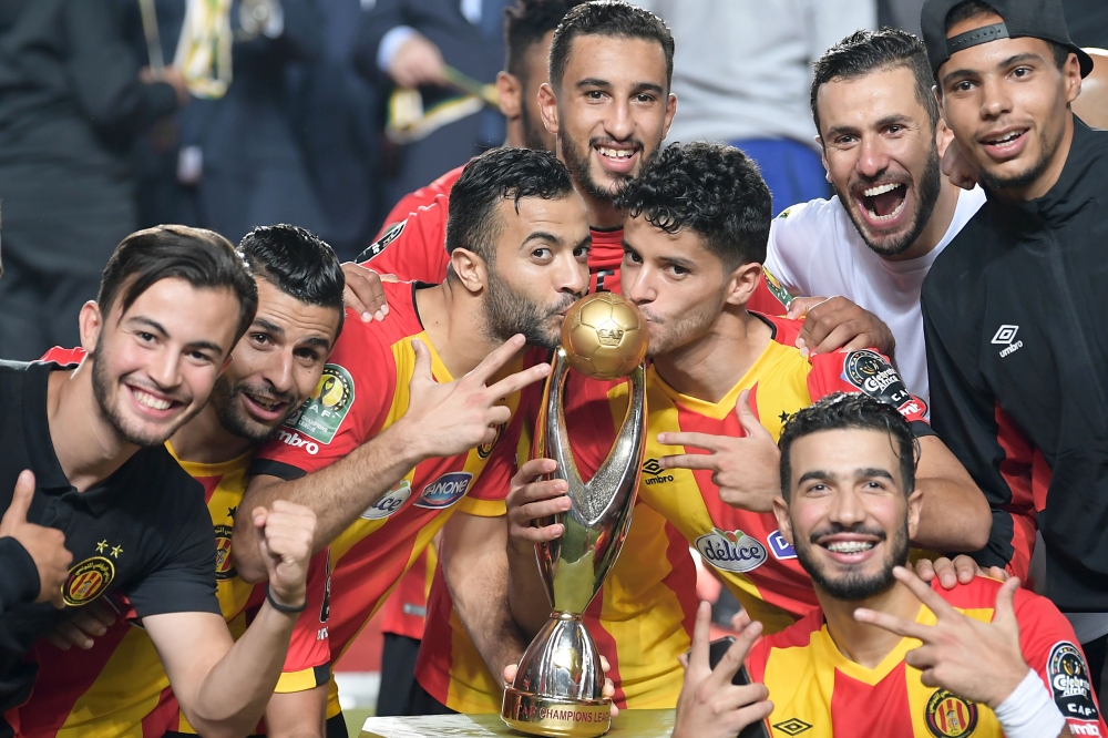 ES Tunis's forward Saad Beguir scores past Al-Ahly's goalkeeper Mohamed El-Shenawy during the CAF Champions League second leg final football match at the Olympic Stadium in Rades on Friday. — AFP