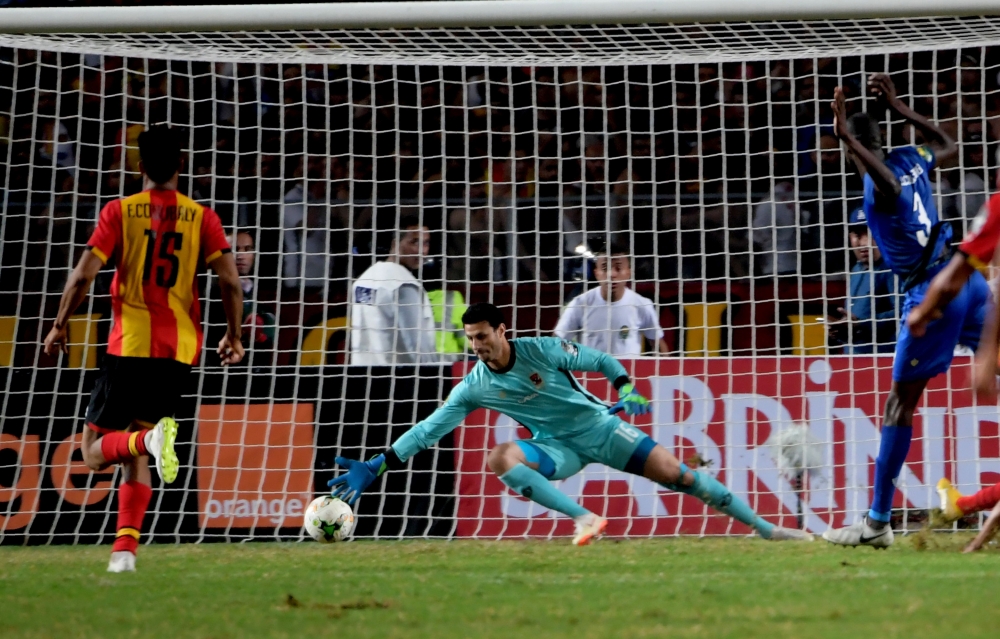 ES Tunis's forward Saad Beguir scores past Al-Ahly's goalkeeper Mohamed El-Shenawy during the CAF Champions League second leg final football match at the Olympic Stadium in Rades on Friday. — AFP