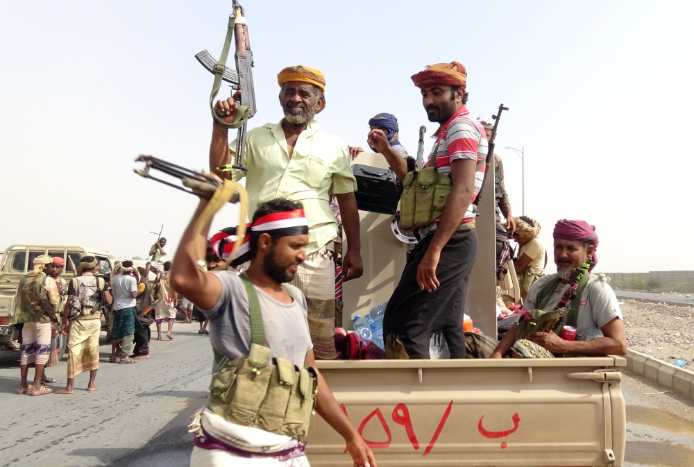 Yemeni pro-government forces gather on the eastern outskirts of Hodeida, as they march ahead to take control of the city from Houthi rebels. — AFP