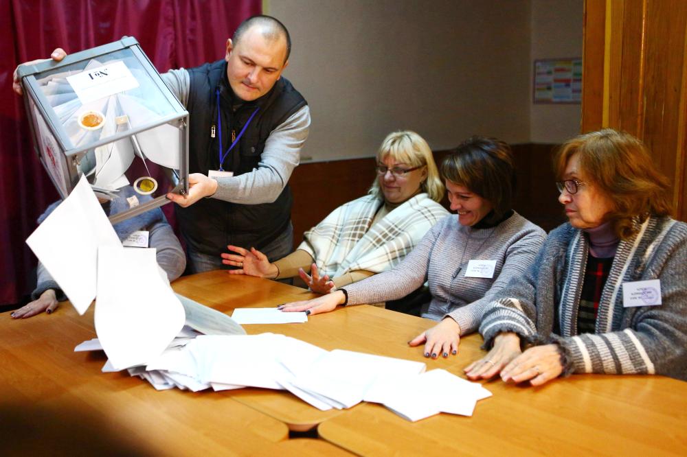 


The election commission members count ballots at polling station in Donetsk, in the rebel-held area of eastern Ukraine, on Sunday, as Kremlin-backed separatists choose their new leaders despite Western calls on Moscow not to sabotage peace talks. — AFP