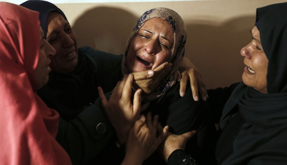 


Relatives mourn the death of Hamad Al-Nahal, a Palestinian killed in an Israeli air strike on the Gaza Strip a day earlier, during his funeral in Rafah, on Tuesday. — AFP
