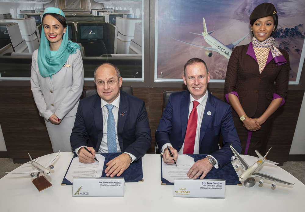 Tony Douglas, Group Chief Executive Officer of Etihad Aviation Group, and  Krešimir Kučko, Chief Executive Officer of Gulf Air, sign the MoU