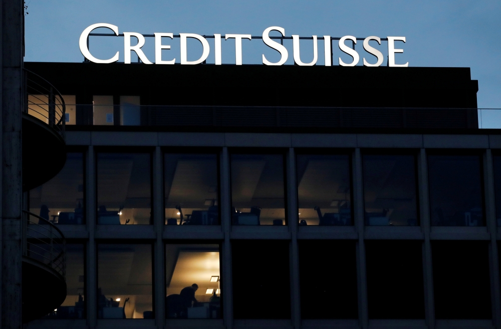 Switzerland's national flag flies under the logo of Swiss bank UBS in Zurich, Switzerland, in this file photo. — Reuters