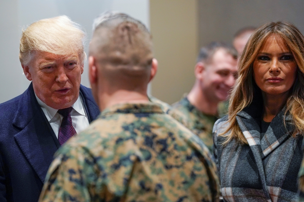 U.S. President Donald Trump and first lady Melania Trump visit US Marines at the Marine Corps Barracks in Washington on Thursday. — Reuters