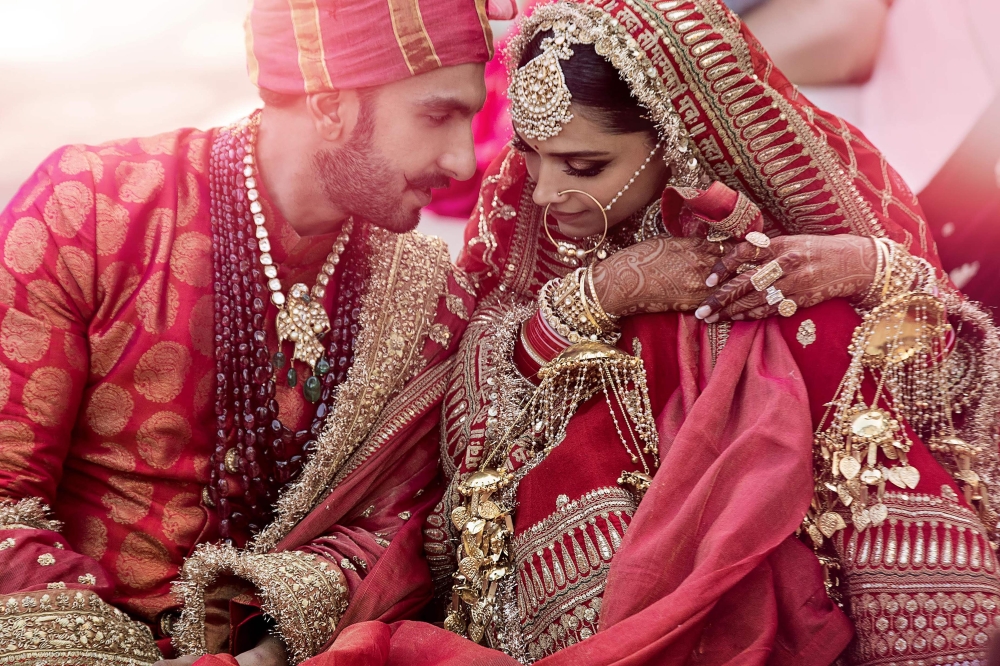 In this handout picture taken on Thursday and released by Yash Raj Films, Bollywood actors Deepika Padukone, right, and Ranveer Singh celebrate their wedding in Lake Como, in the northern Italy’s Lombardy region. — AFP