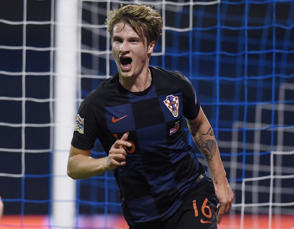 Croatia's Tin Jedvaj celebrates after scoring a goal during the UEFA Nations League football match between Croatia and Spain at the Maksimir Stadium in Zagreb on Thursday. — AFP