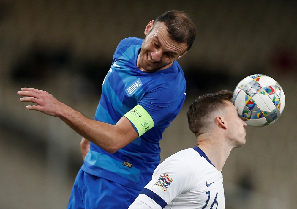 Greece's Vasilis Torosidis in action with Finland's Juha Pirinen during the UEFA Nations League C Group 2 clash at the Olympic Stadium, Athens, Greece, on Thursday. — Reuters