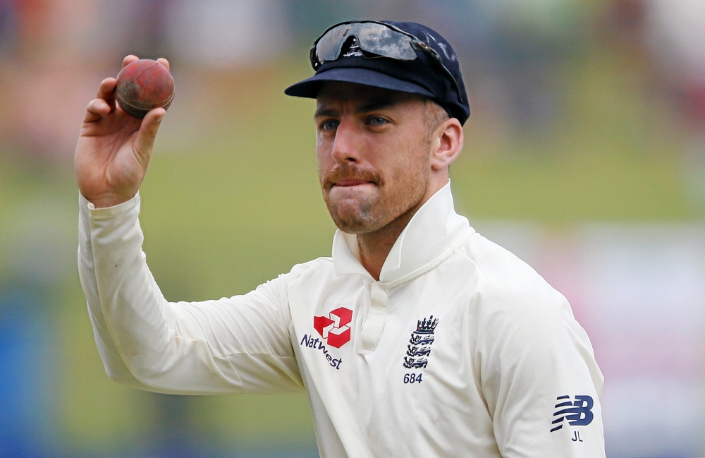 England's captain Joe Root (2nd R) congratulates his teammates after they won the second cricket Test match against Sri Lanka at Pallekele, Sri Lanka, on Sunday. — Reuters