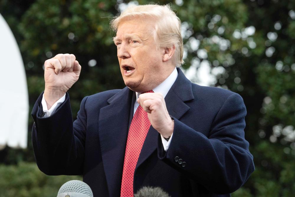 


US President Donald Trump speaks to the press before departing the White House for Paris in Washington in this Nov. 9, 2018 file photo. — AFP