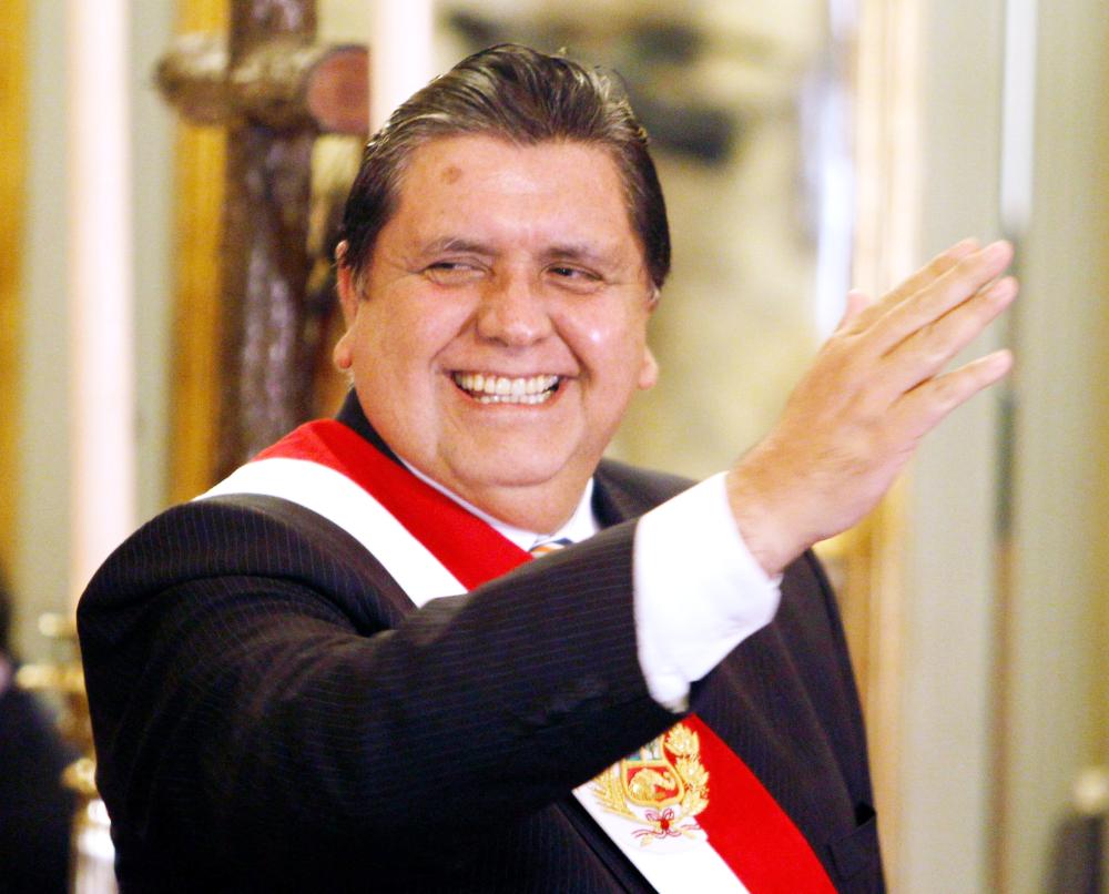 


Former Peru President Alan Garcia waves to the crowd during his new Cabinet swearing-in ceremony at the Government Palace in Lima, Peru, in this Sept. 14, 2010 file photo. — Reuters