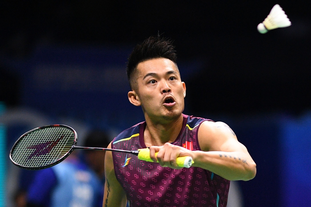 This file picture shows Lin Dan of China hitting a shot against Mark Caljouw of the Netherlands in their men's singles match during the badminton World Championships in Nanjing, Jiangsu province. Dan is regarded as the best badminton player of all time but his brilliant career is ending in a sorry whimper and he is danger of becoming a figure of ridicule. — AFP