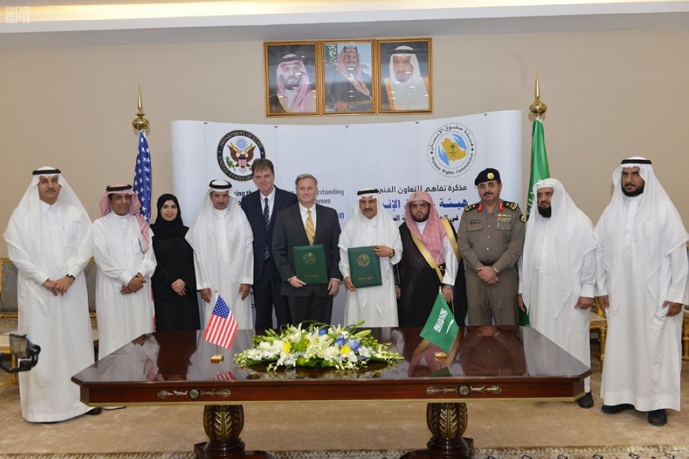 


Officials of the Saudi Human Rights Commission and US State Department’s Office to Monitor and Combat Trafficking in Persons after signing the MoU for technical cooperation. — SPA
