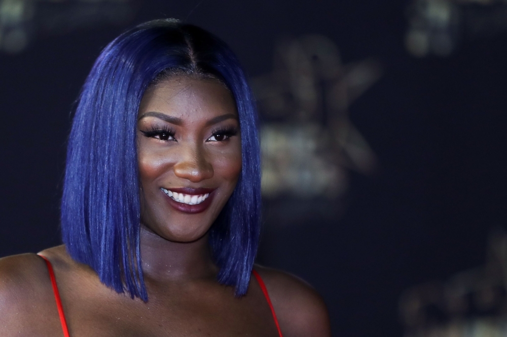 In this file photo taken on Nov. 10, 2018 Franco-Malian singer Aya Danioko aka Aya Nakamura poses on the red carpet upon her arrival to attend the 20th NRJ Music Awards ceremony at the Palais des Festivals, in Cannes, southeastern France.  This year, the contenders for Afrima (All Africa Music Awards) include the Franco-Malian Aya Nakamura and the surprising Afrotronix, an artist of Chadian origin who dresses in costume like Daft Punk and makes house music with Sahelian rhythms and lyrics in Spanish.— AFP