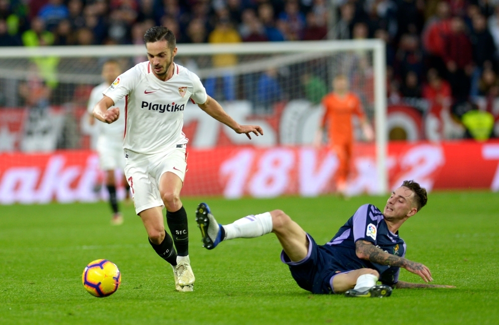 Sevilla's Spanish midfielder Pablo Sarabia (L) vies for the ball with Real Valladolid's Spanish defender Fernando Calero (R) during the Spanish league football match at the Ramon Sanchez Pizjuan stadium in Sevilla on Sunday. — AFP