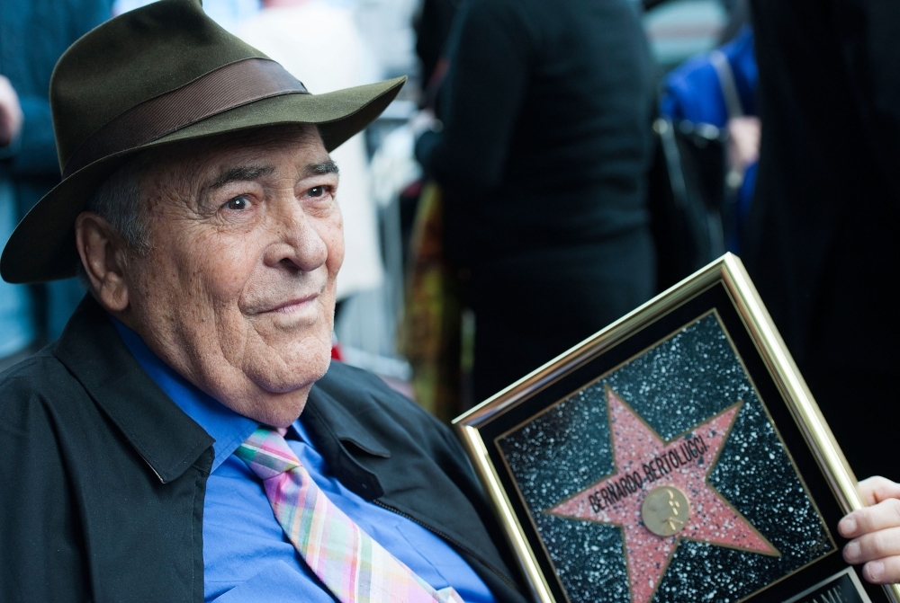 In this file photo taken on November 19, 2013, Italian director Bernardo Bertolucci celebrates his Star on the Hollywood Walk of Fame in Hollywood, California. — AFP