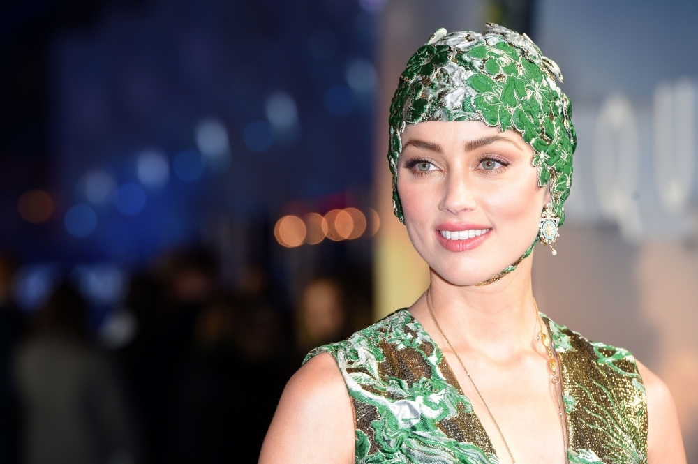US actor Amber Heard poses upon arrival to attend the World Premiere of the film 