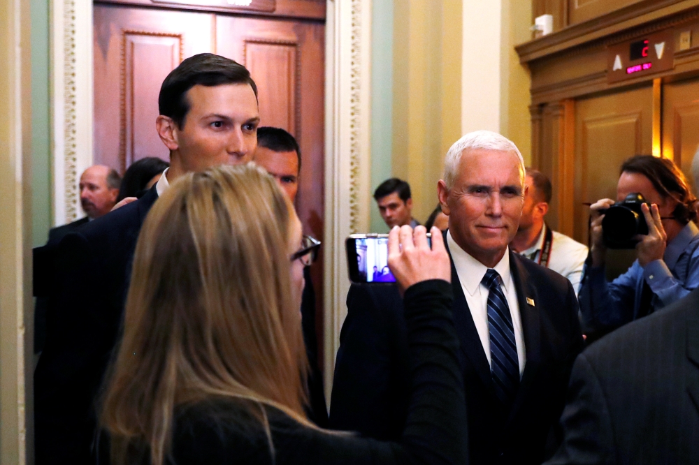 US Vice President Mike Pence and White House senior adviser Jared Kushner, left, arrive for the Senate Republican weekly policy lunch at the US Capitol in Washington on Tuesday. — Reuters