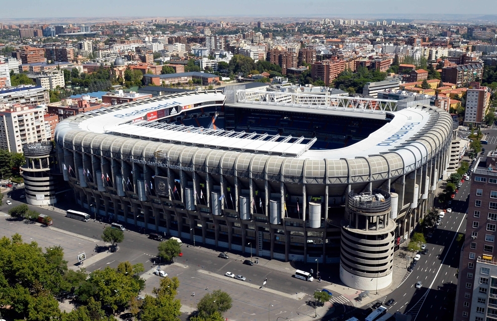 This file photo  shows an aerial view of Real Madrid's Santiago Bernabeu Stadium from the top of the Europa Tower in Madrid. Real Madrid's Santiago Bernabeu Stadium may host the second leg of the Copa Libertadores final between Argentine rivals River Plate and Boca Juniors postponed after fan violence at the weekend, Spanish media said on Thursday. — AFP
