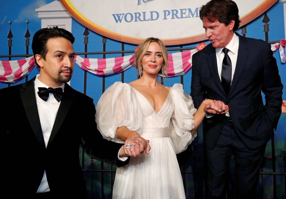 Cast member Lin Manuel-Miranda, Emily Blunt and director Rob Marshall pose at the world premiere of Disney’s movie 
