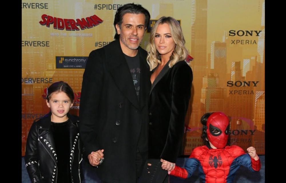 Edwin Arroyave and Teddi Jo Mellencamp  attend the premiere of Columbia Pictures and Sony Pictures Animation's 