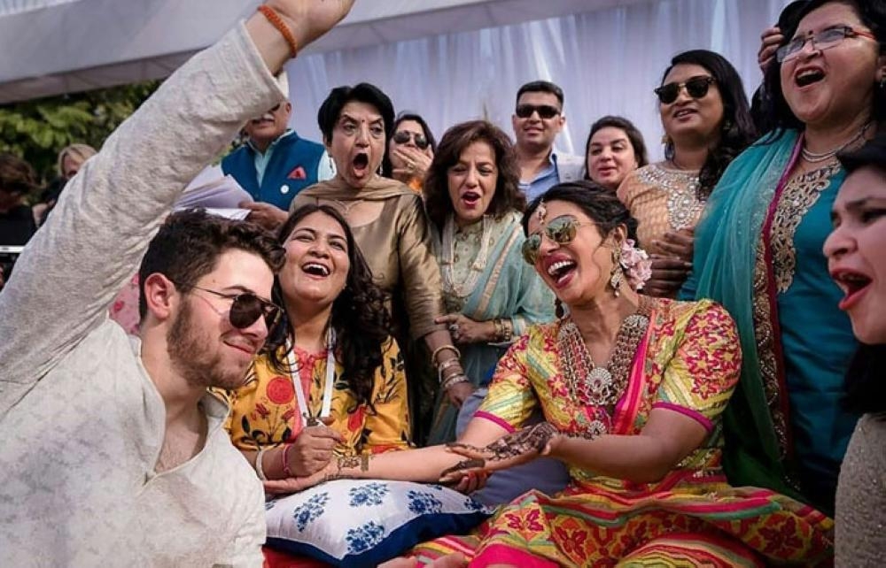 This handout photo released by Raindrop Media shows Bollywood actress Priyanka Chopra (center R) and American singer Nick Jonas (L) during their wedding celebration along with friends and relatives at Umaid Bhawan palace in Jodhpur. — AFP