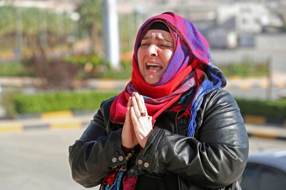 Nancy Roxana Papa, an 54-year-old Argentinian woman who was recently released after being kidnapped since 2016, speaks to the press at the Bab Al-Hawa crossing with Turkey on Friday ahead of being handed over to Turkish authorities.  — AFP