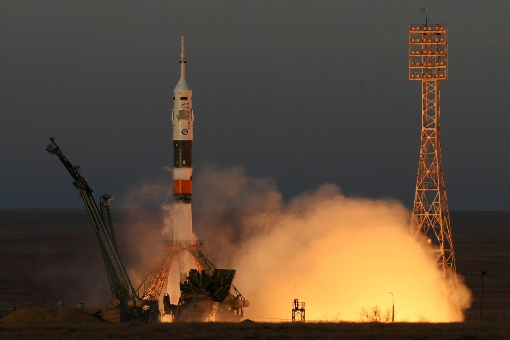 Russia's Soyuz MS-11 spacecraft carrying the members of the International Space Station (ISS) expedition 58/59, Russian cosmonaut Oleg Kononenko, NASA astronaut Anne McClain and David Saint-Jacques of the Canadian Space Agency, blasts off to the ISS from the launch pad at the Russian-leased Baikonur cosmodrome, Monday. —  AFP