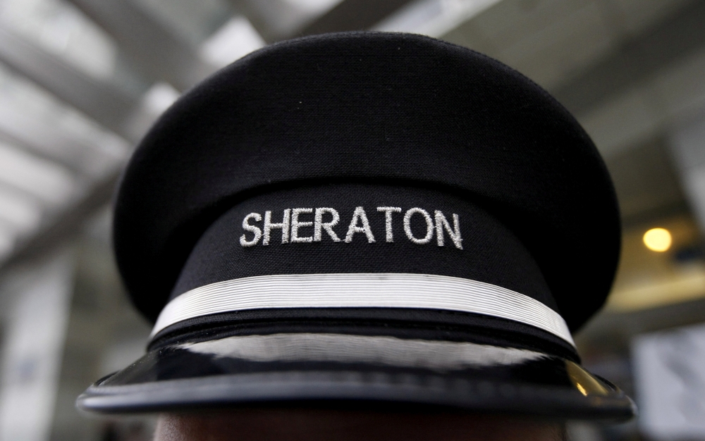  A doorman's hat at Sheraton hotel, a brand of Starwood Hotels & Resorts Worldwide, is pictured in Warsaw in this file photo. — Reuters