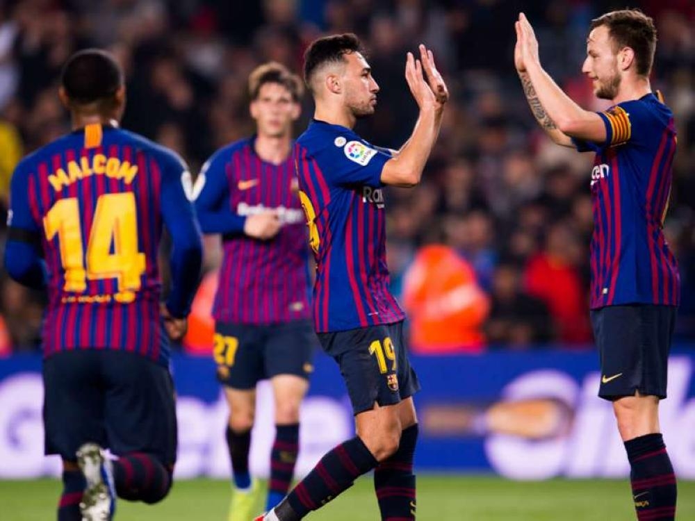 Barcelona players jubilate after the Copa del Rey thrashed Cultural Leonesa 4-1 on Wednesday to progress to the last 16 of the torunament on aggregate on Wednesday.