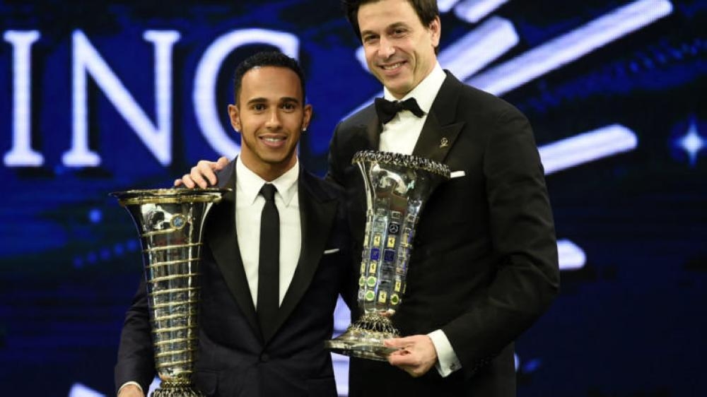 Mercedes’ Lewis Hamilton and Toto Wolff with their respective Drivers’ and Constructors’ World Championship trophies after the FIA awards ceremony in St. Petersburg Friday. — Reuters