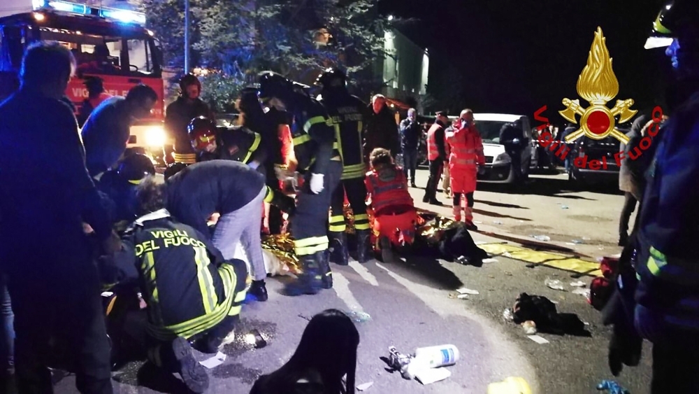 


The picture taken and released by Vigili del Fuoco, the Italian fire and rescue service, on Saturday shows emergency personnel treating victims after a stampede at a nightclub in Cornaldo. — AFP