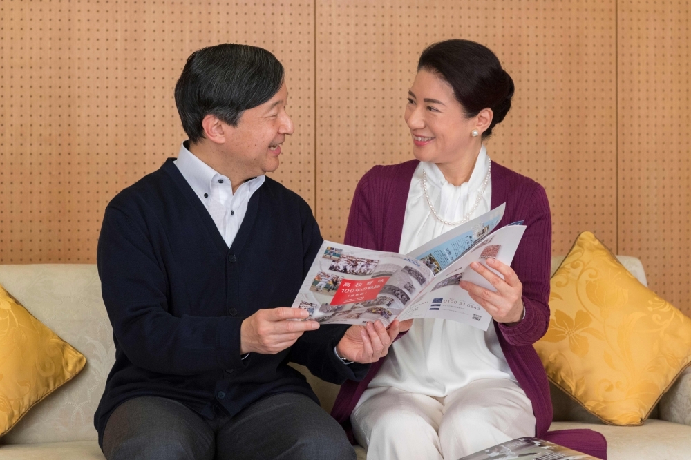 This handout picture provided by the Imperial Household Agency of Japan shows Japan's Crown Princess Masako (R) and her husband Crown Prince Naruhito (L) sharing a book at Togu Palace in Tokyo. — AFP