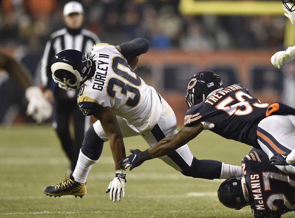 Los Angeles Rams’ running back Todd Gurley is tackled by Chicago Bears’ inside linebacker Danny Trevathan (59) and Sherrick McManis at Soldier Field in Chicago Sunday. — Reuters