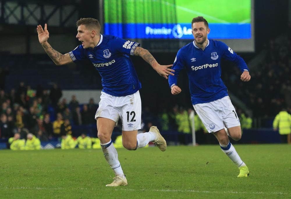 


Everton’s defender Lucas Digne (L) celebrates scoring his team’s second goal during the English Premier League match against Watford at Goodison Park in Liverpool Monday. — AFP 