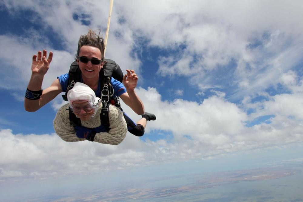 This handout photo released by SA Skydiving shows 102-year-old great-grandmother Irene O’Shea during her skydive tandem jump over Wellington in South Australia. — AFP