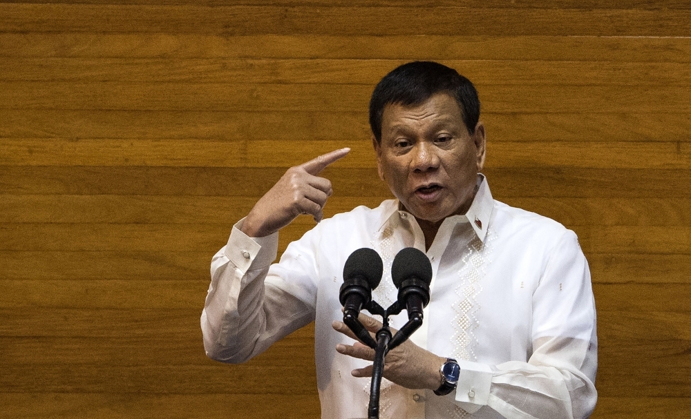 President of the Philippines Rodrigo Duterte gestures as he delivers his state of the nation address at Congress in Manila in this July 24, 2017 file photo. — AFP