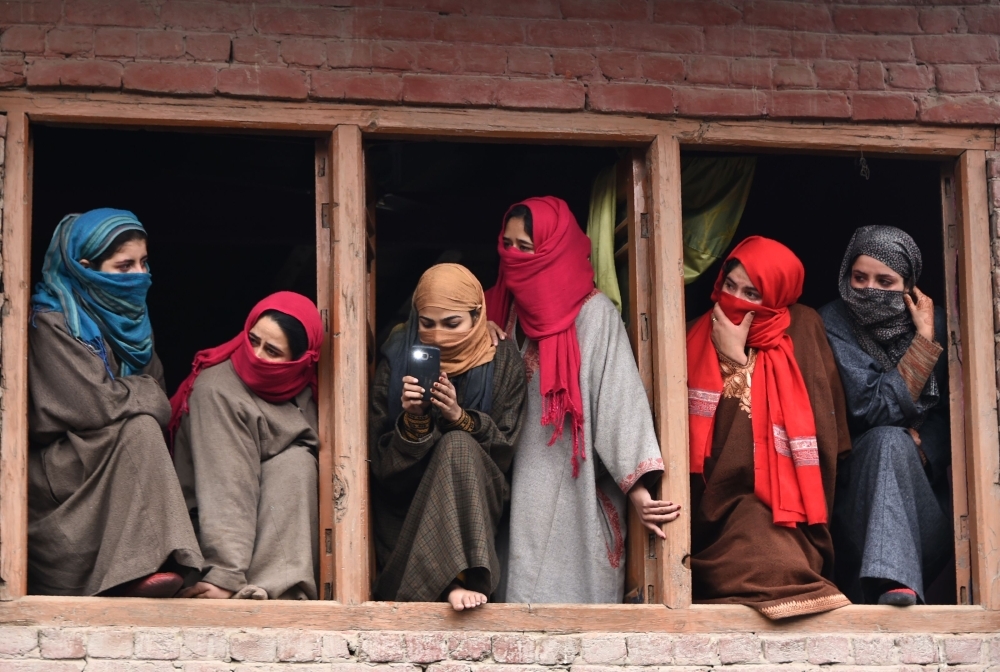 Kashmiri villagers watch from a balcony during a funeral procession in Hajin,north of Srinagar, in this Dec. 10, 2018 file photo. — AFP