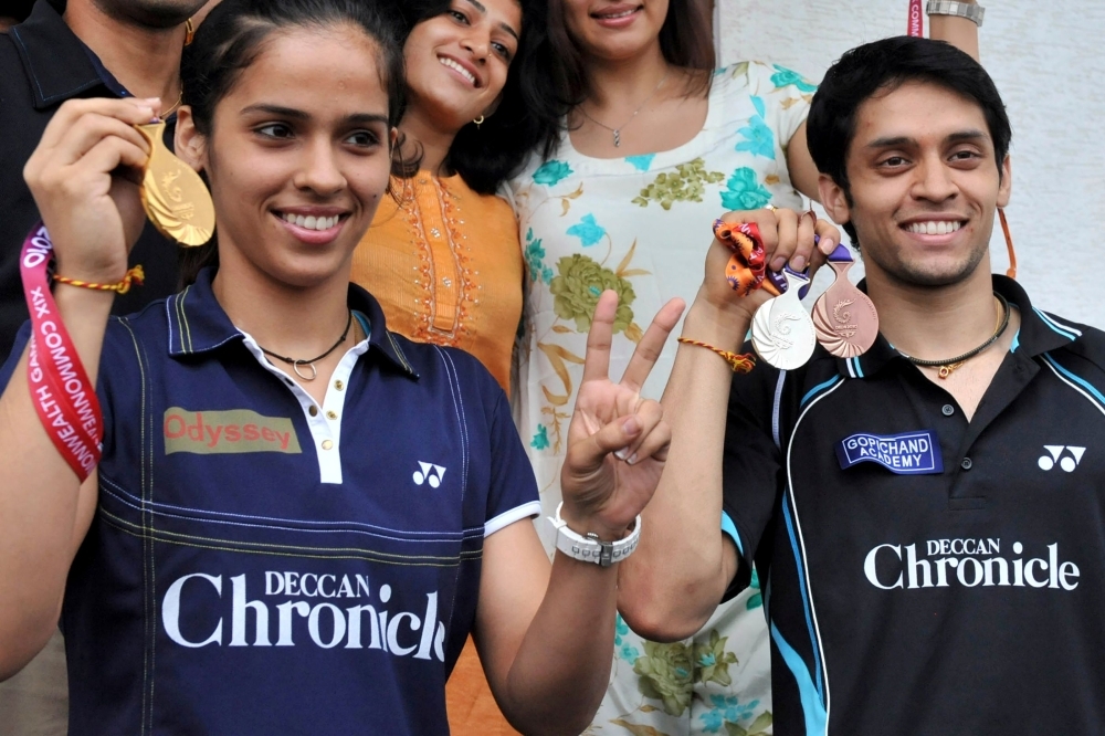 Indian badminton players Saina Nehwal, left, and Parupalli Kashyap pose with their New Delhi Commonwealth Games medals prior to a press conference in Hyderabad in this Oct. 16, 2010 file photo. — AFP