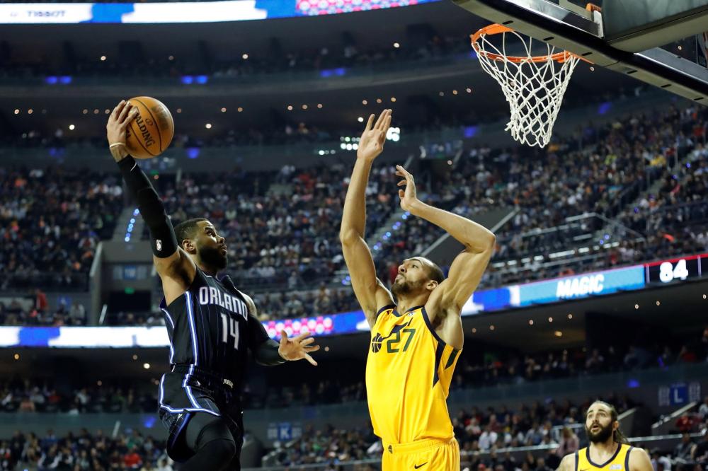 Orlando Magic’s guard D.J. Augustin shoots against Utah Jazz’s center Rudy Gobert during their NBA game at Arena Ciudad de Mexico Saturday. — Reuters 