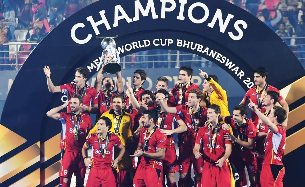 Belgium's players celebrate with the world cup trophy after defeating Netherlands in the field Hockey final at the 2018 Hockey World Cup in Bhubaneswar Sunday. — AFP