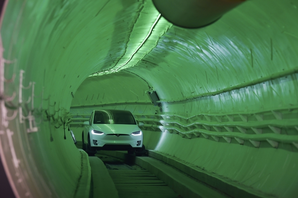 Elon Musk, co-founder and chief executive officer of Tesla Inc., speaks during an unveiling event for the Boring Company Hawthorne test tunnel in Hawthorne, south of Los Angeles, California. — AFP