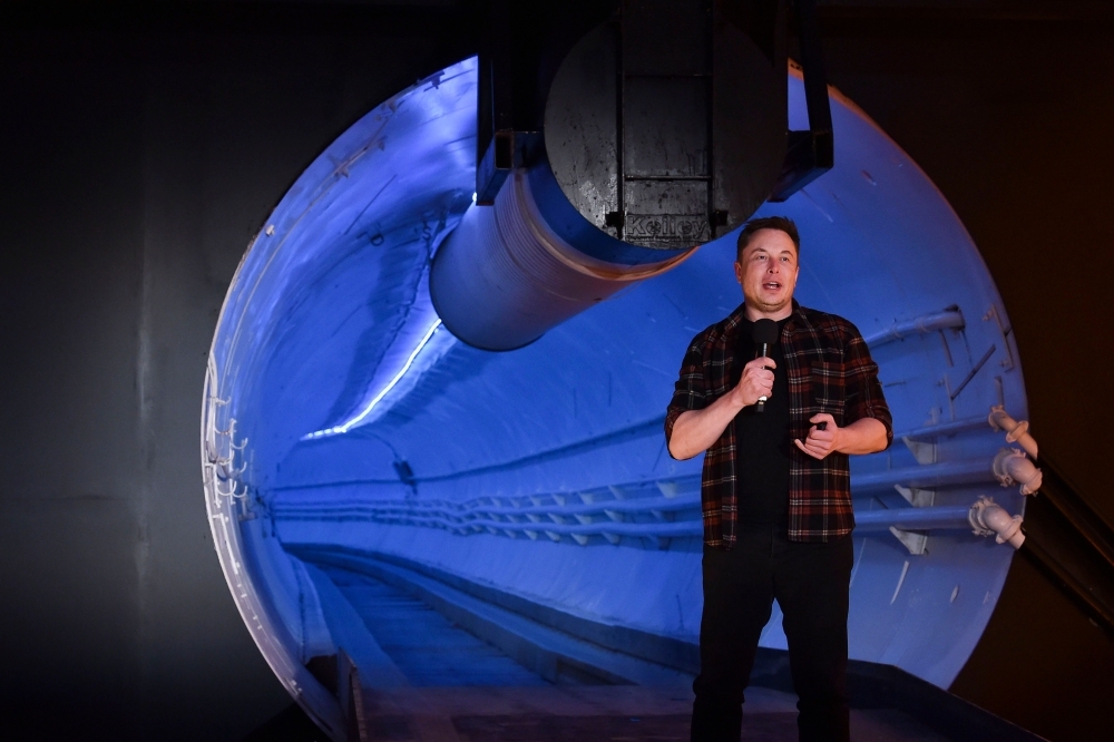 Elon Musk, co-founder and chief executive officer of Tesla Inc., speaks during an unveiling event for the Boring Company Hawthorne test tunnel in Hawthorne, south of Los Angeles, California. — AFP