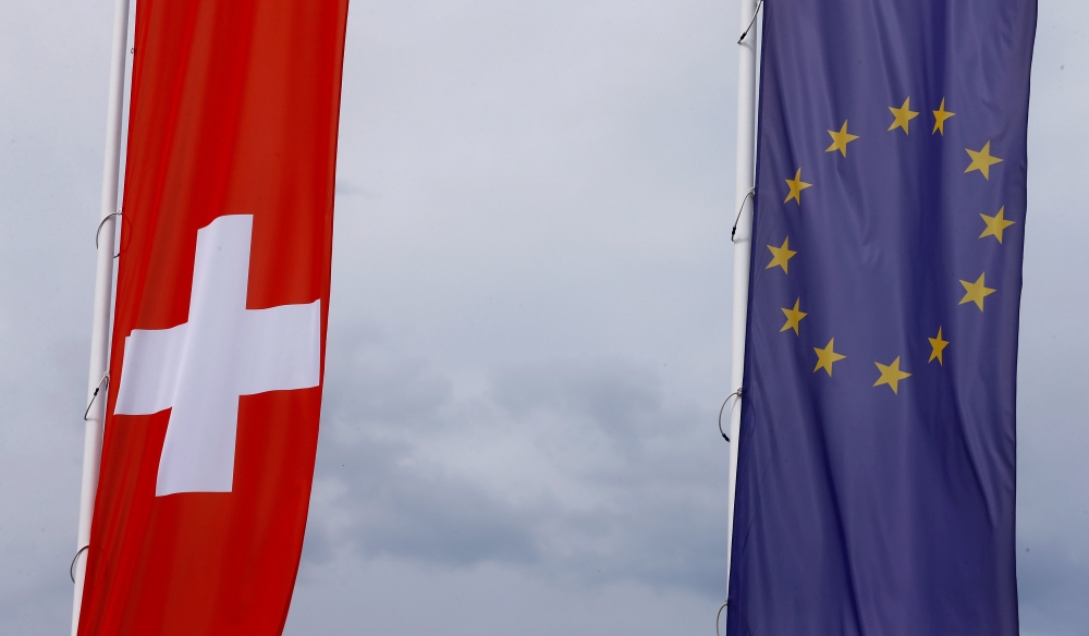 The flags of the European Union and Switzerland flutter in the wind in Blotzheim, France, in this June 27, 2017 file photo. — Reuters
