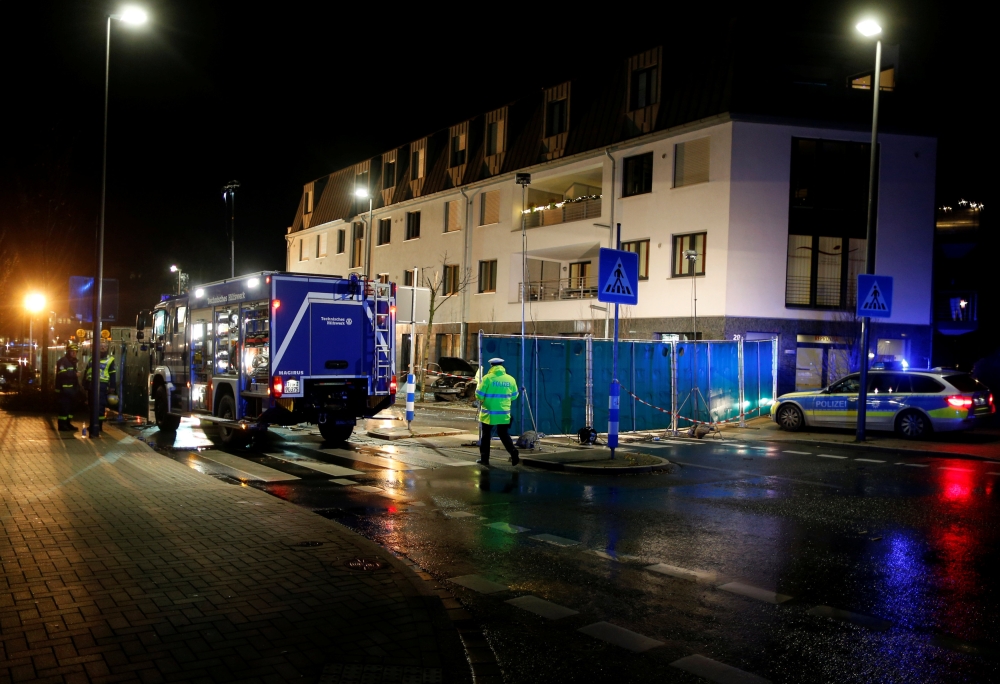 Police officers inspect the scene where a car plowed into a bus stop in Recklinghausen, Germany, on Thursday. — Reuters