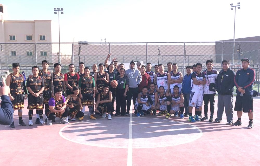 Marcafe and Arabian Homes teams pose before the championship game.