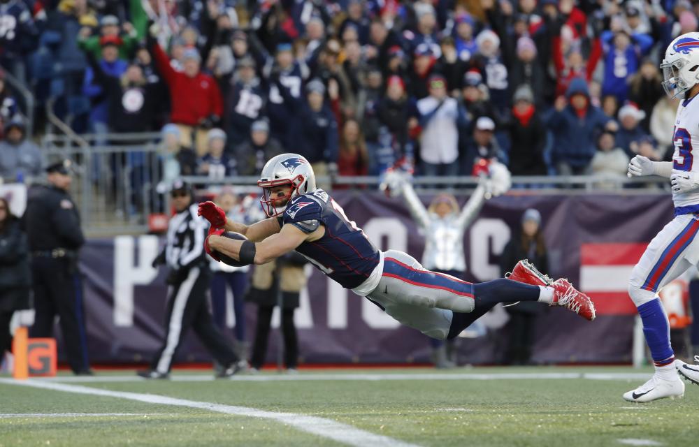 New England Patriots’ wide receiver Julian Edelman dives for the touchdown against the Buffalo Bills in the third quarter at Gillette Stadium in Foxborough Sunday. — Reuters
