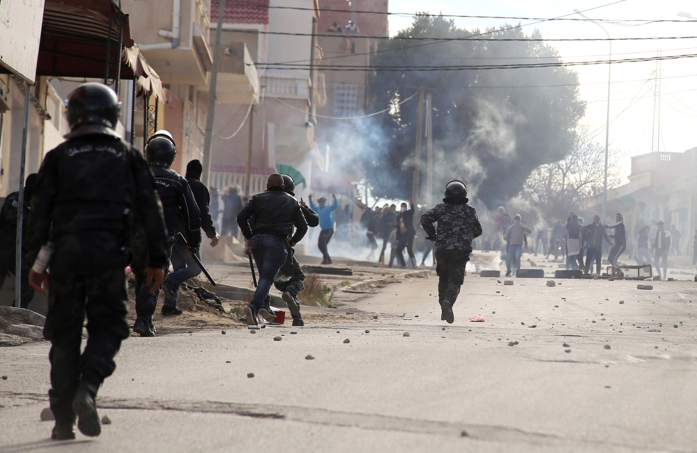 Riot police clash with protesters during demonstrations in Kasserine, Tunisia on Tuesday.  